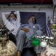 FILE PHOTO: Patients suffering from the coronavirus disease (COVID-19) get treatment at the casualty ward in Lok Nayak Jai Prakash (LNJP) hospital, amidst the spread of the disease in New Delhi